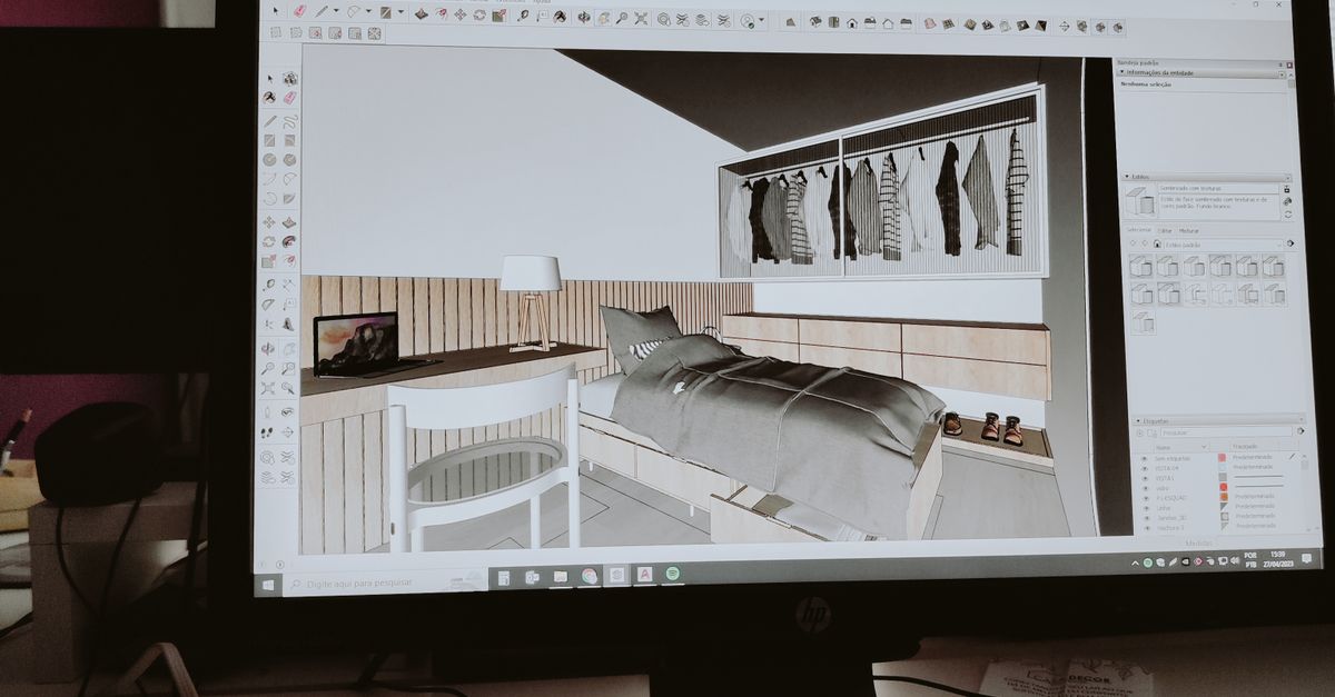 A desktop monitor displaying a 3D room design in a contemporary office setting.